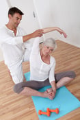 Sport coach training senior woman with stretching exercises-1