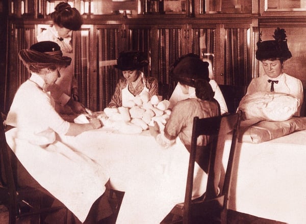 volunteers making gauze rolls- early 1900's.jpg